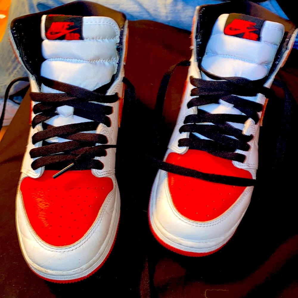 Red and white Jordan’s with black laces size 5.5 in women
